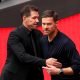 Diego Simeone with Real Madrid manager Xabi Alonso