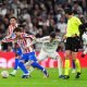 Alex Baena of Atletico Madrid and Federico Valverde of Real Madrid