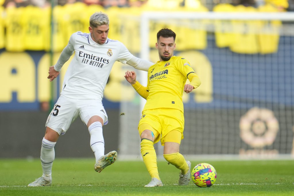 Alex Baena of Atletico Madrid and Federico Valverde of Real Madrid